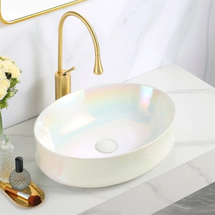 Luxurious Iridescent Electroplated Basin with Gold Faucet on White Marble Vanity